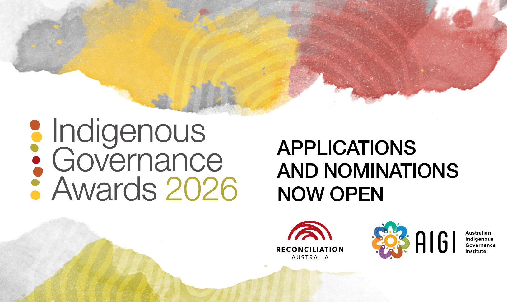 One man and two women holding a framed certificate and a crved metal trophy in front of a media banner.