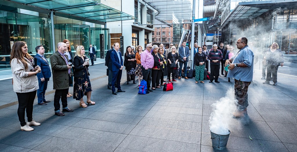 Acknowledgement of Country and smoking ceremony outside a city buidling