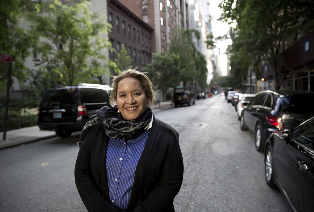 Image of Professor Megan Davis outside UN building in NYC.