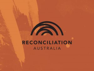 Reconciliation Australia logo on orange splash