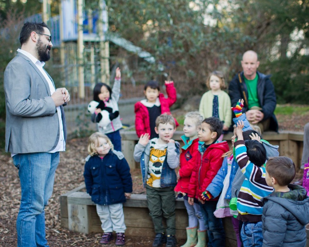 Teacher and children learning outside the classroom