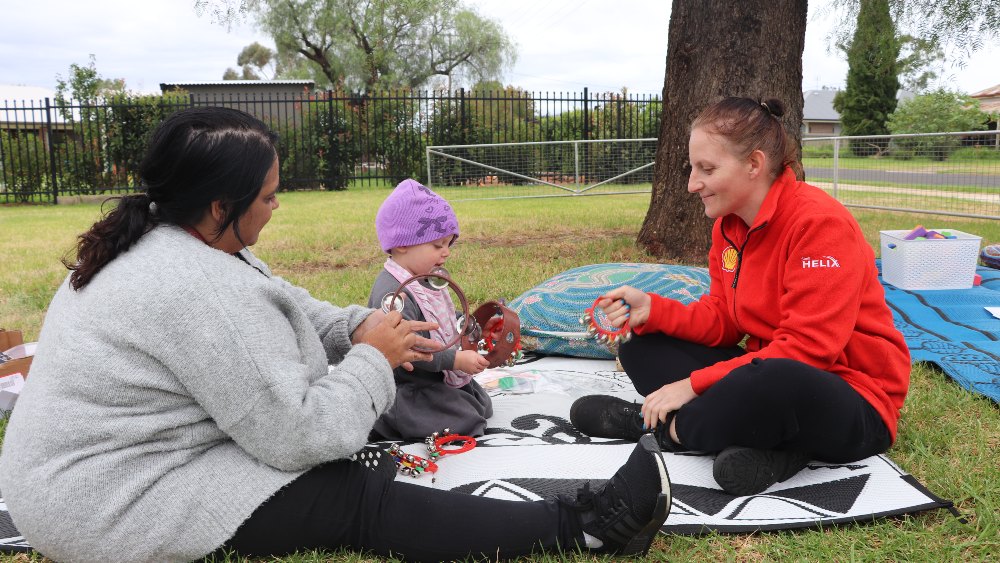 Mum and bub playing in the park at pop-up preschool in the park