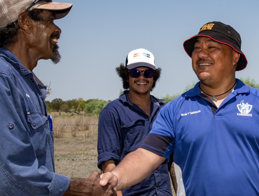 Indingeous Governance Awards judge, Eddie Cubillo, shaking hands with staff member at finalist organisation