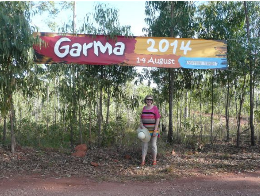 Kathryn Dunn stands in front of 2014 Garma sign.