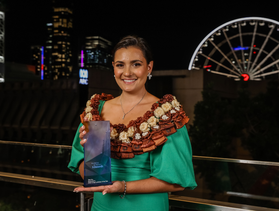 Image of Talei Elu holding award for 2023 Queensland Young Australian of the year.