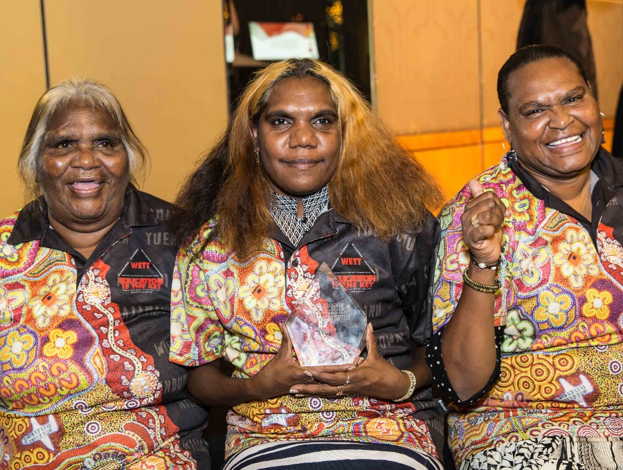 Representatives from Warlpiri Education and Training Trust pose with their award.