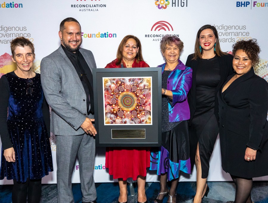 Representatives of Wungening Aboriginal Corporation pose for a photo holding their award.