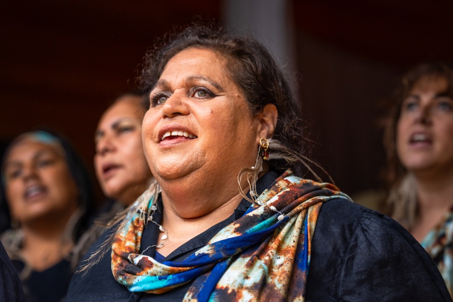 Cheryl singing in the Dhurga language with Djinama Yilaga Choir at the 2023 Four Winds Music Festival in Barragga Bay NSW, on Yuin Country. Photo: David Rogers