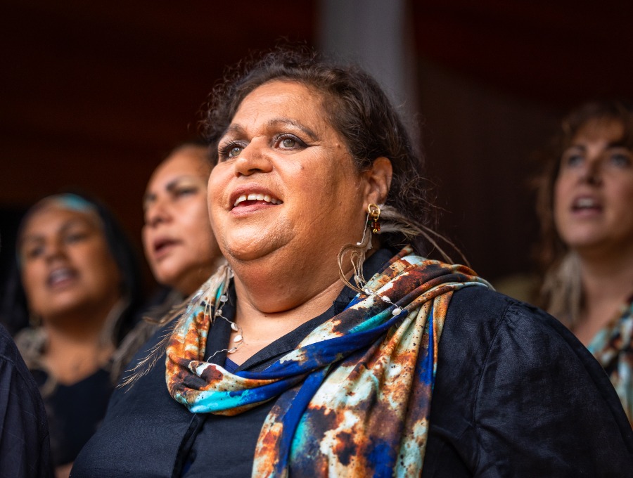 Cheryl singing in the Dhurga language with Djinama Yilaga Choir at the 2023 Four Winds Music Festival in Barragga Bay NSW, on Yuin Country. Photo: David Rogers