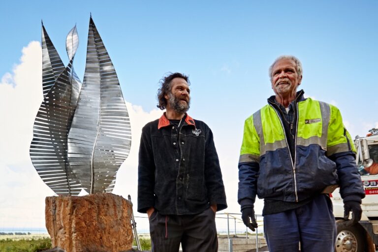 Walter Saunders with the newly installed Mayapa Weeyn sculpture, alongside Jason Scott who collaborated on the construction. Photo: Damian Goodman