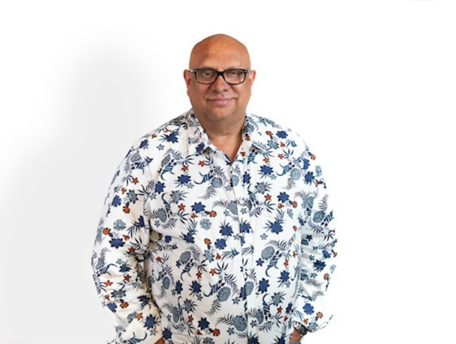 Phil Duncan standing in front of a white background.