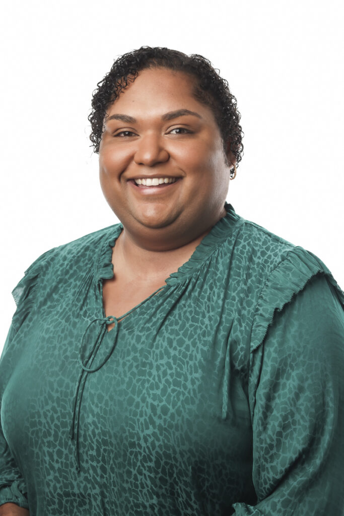 Torres Strait Islander woman in a sea green coloured shirt