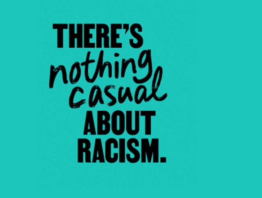The words of the campaign - 'there's nothing casual about racism' - in black on a teal background. 'nothing casual' is rendered is stylised handwritten font, the rest in block capitals.