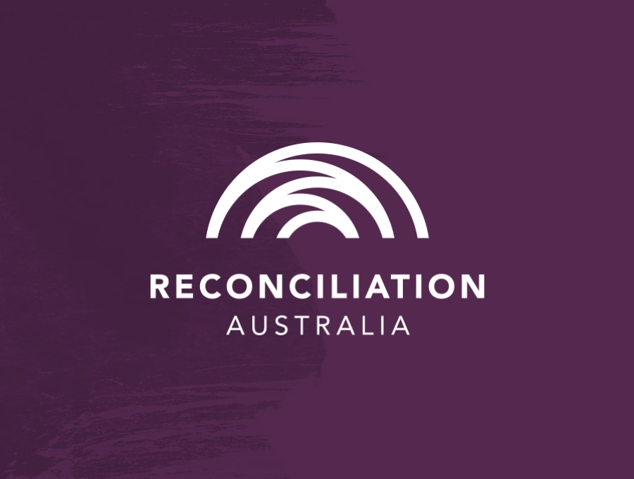 Reconciliation Australia logo on aubergine splash